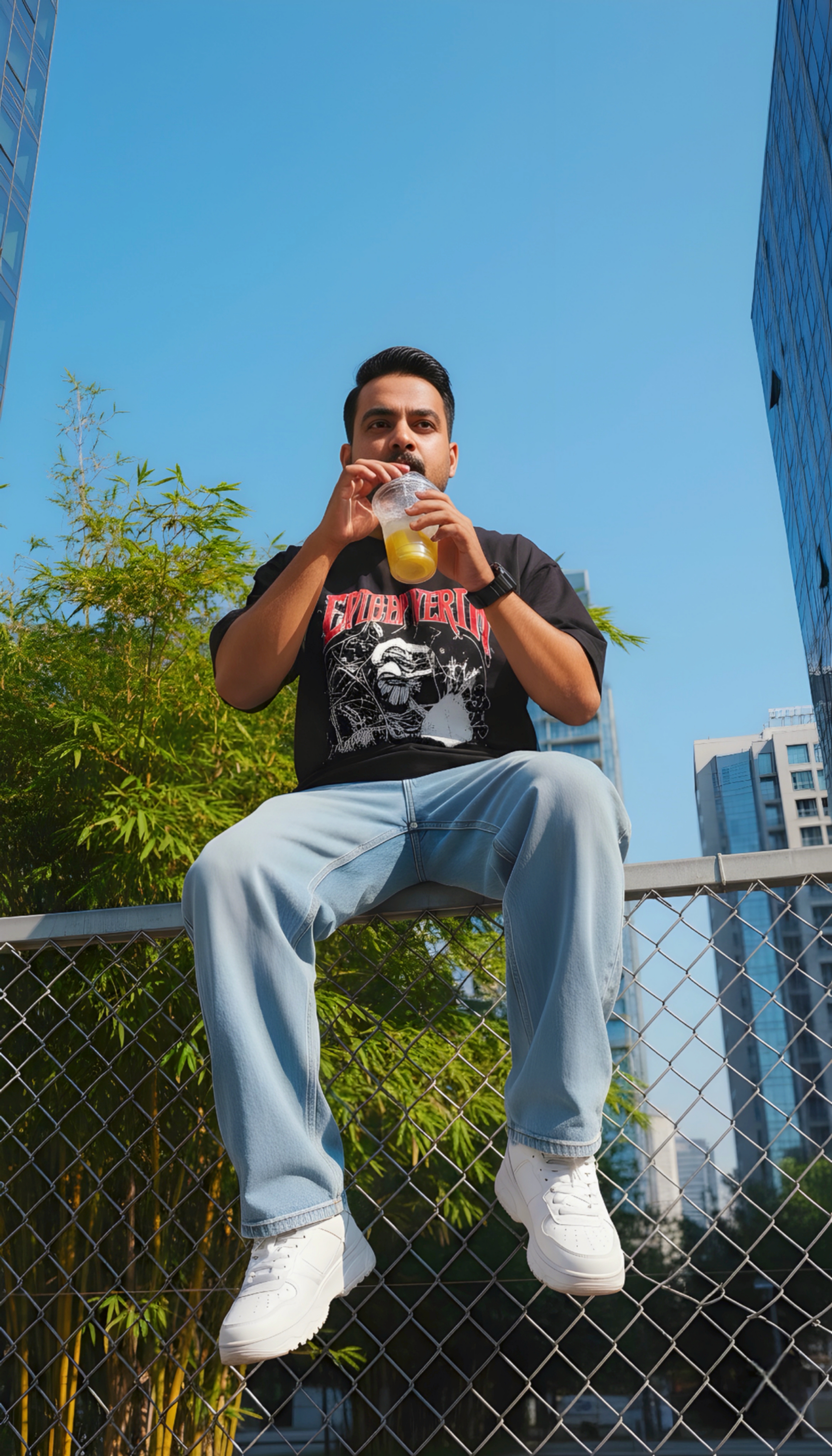 Sitting on a steel wire fence